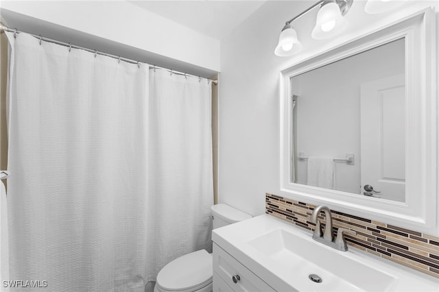 4629 SE 5th Pl Unit 12, Cape Coral, FL 33904 - full bathroom featuring toilet, tasteful backsplash, vanity, and curtained shower