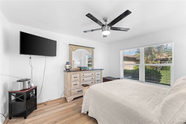 bedroom with light wood-type flooring and ceiling fan