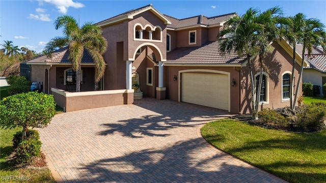 mediterranean / spanish house with a front lawn