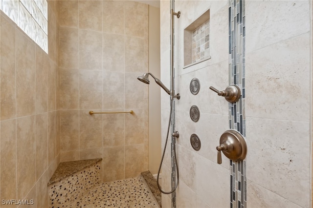 bathroom featuring tiled shower