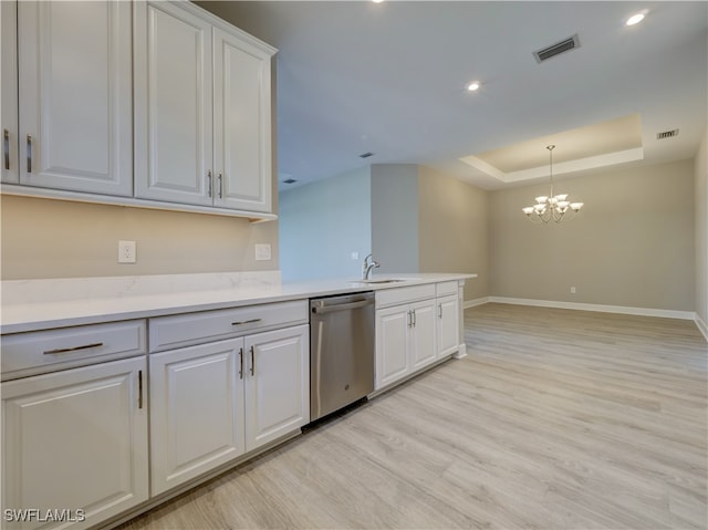 kitchen with dishwasher, white cabinets, a chandelier, and light hardwood / wood-style flooring