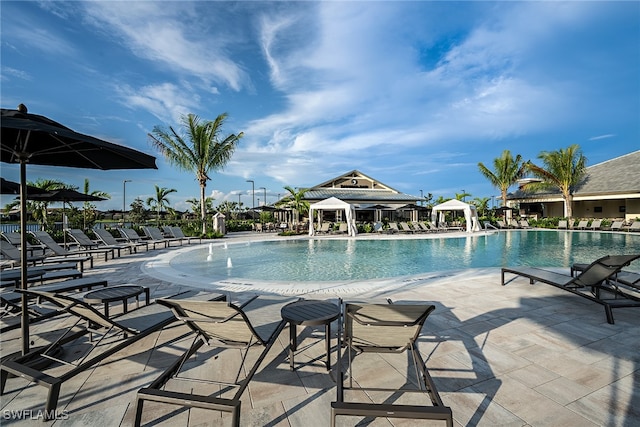 view of swimming pool with a gazebo and a patio