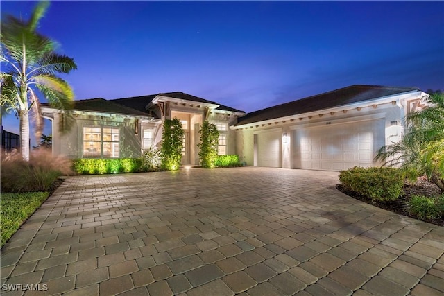 mediterranean / spanish house featuring a garage