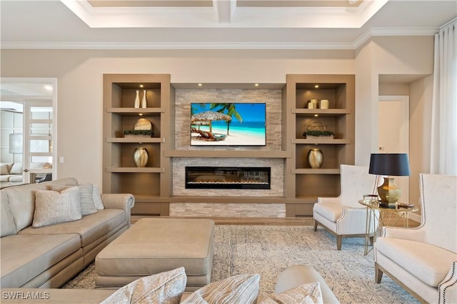 living room with ornamental molding and built in features