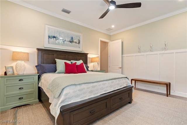 bedroom featuring ceiling fan and ornamental molding