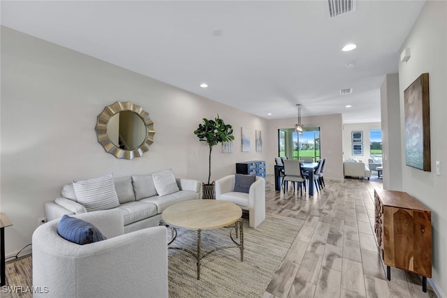 living room with light hardwood / wood-style floors