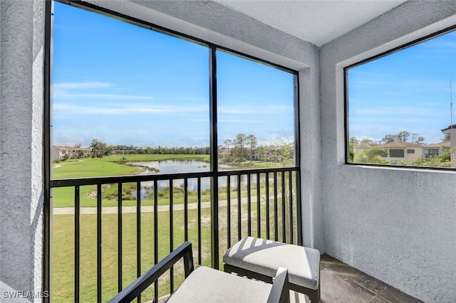 sunroom with a water view