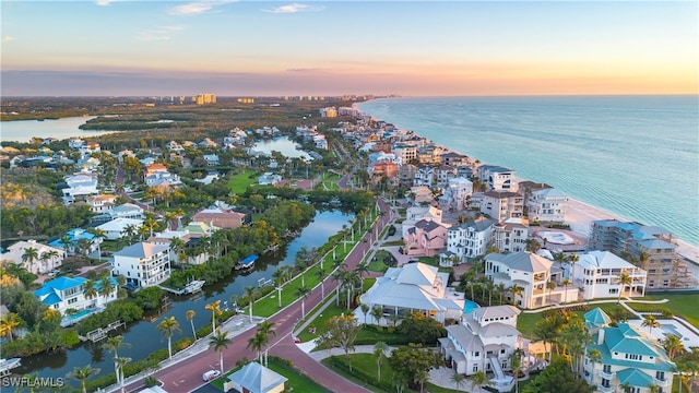 aerial view at dusk with a water view