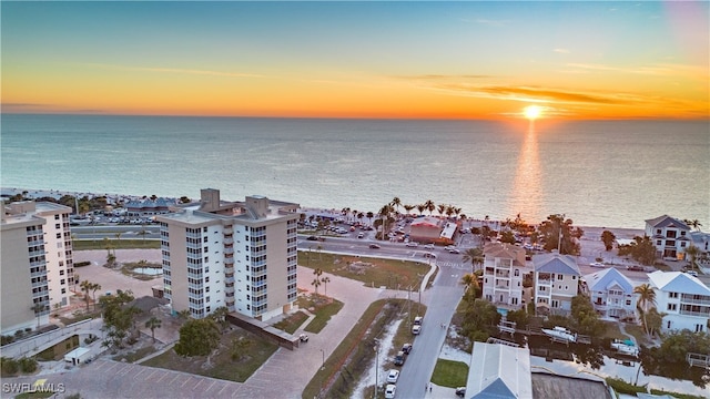 aerial view at dusk with a water view