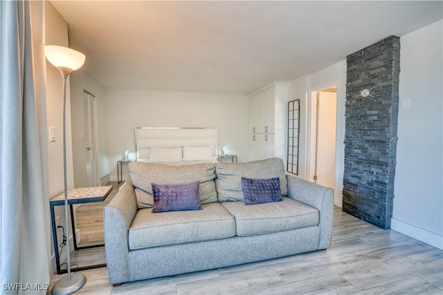 bedroom featuring a closet and light hardwood / wood-style floors