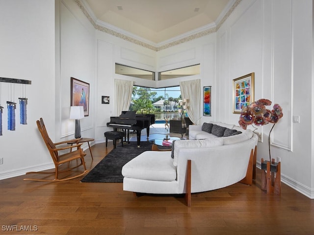 living room featuring hardwood / wood-style flooring and ornamental molding