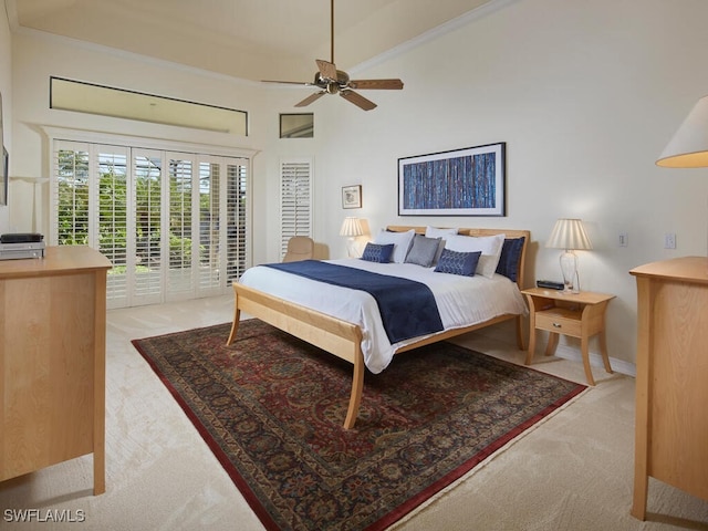 bedroom with ceiling fan, light colored carpet, and access to exterior