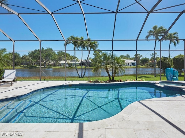 view of swimming pool with a water view, glass enclosure, an in ground hot tub, and a patio area