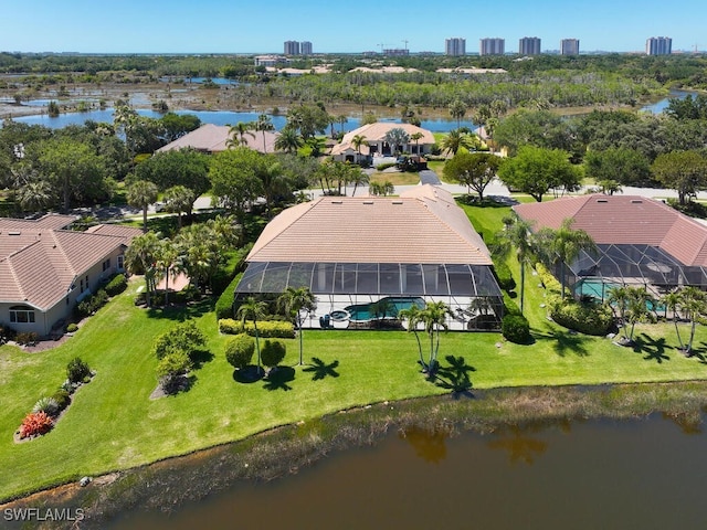 birds eye view of property with a water view