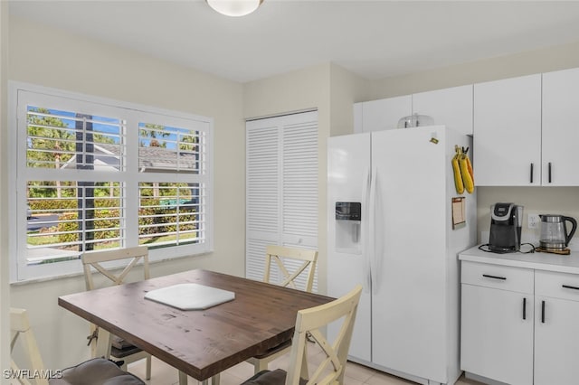 dining area featuring light tile patterned floors