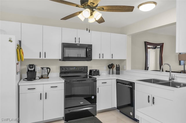 kitchen featuring ceiling fan, sink, black appliances, light tile patterned floors, and white cabinets