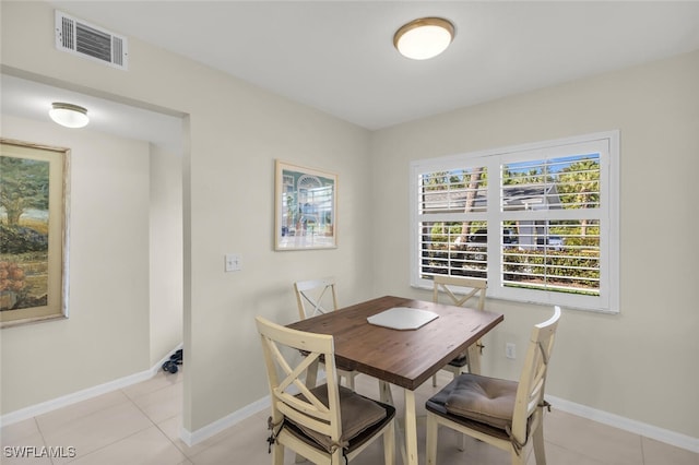 dining area featuring light tile patterned floors