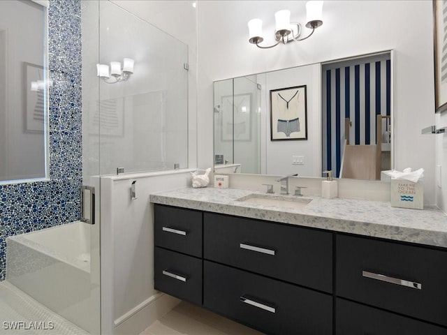 bathroom with a stall shower and vanity