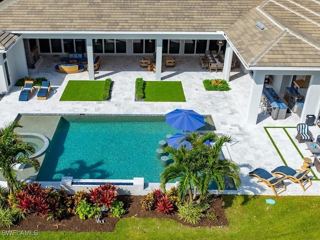 outdoor pool featuring a patio and an outdoor living space