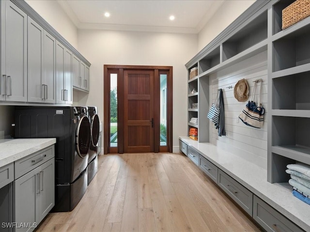 clothes washing area with recessed lighting, cabinet space, ornamental molding, light wood-type flooring, and independent washer and dryer