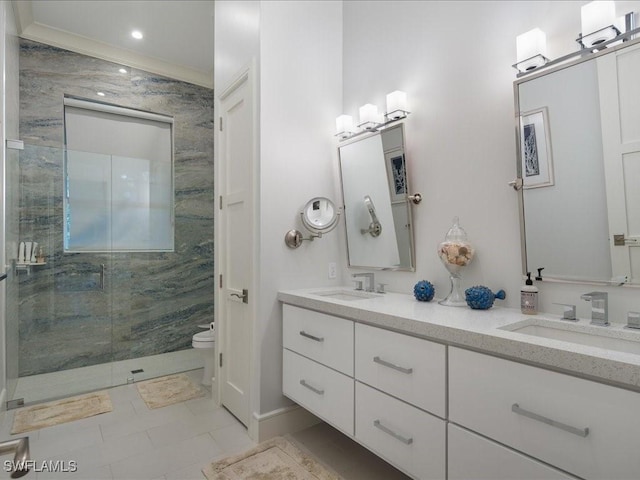 bathroom featuring a stall shower, a sink, toilet, and double vanity