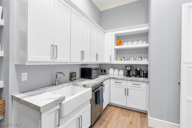 kitchen with open shelves, stainless steel appliances, light wood-style floors, white cabinets, and light stone countertops