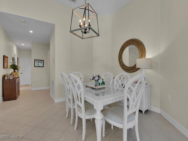 dining room featuring an inviting chandelier and light tile patterned flooring