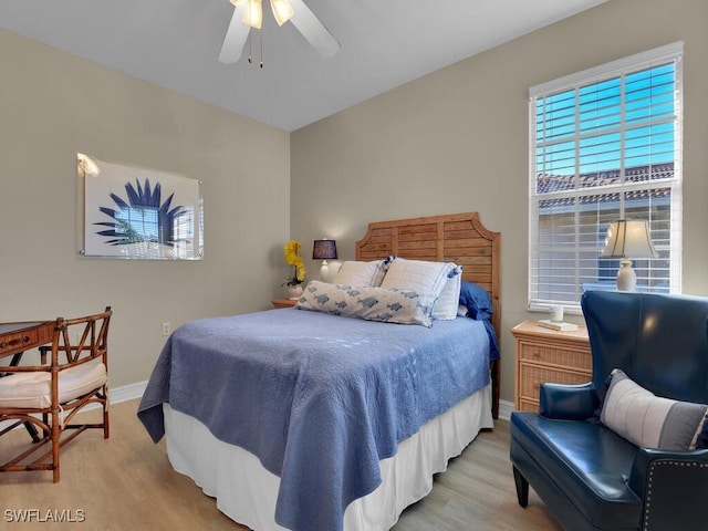 bedroom featuring light wood-type flooring and ceiling fan