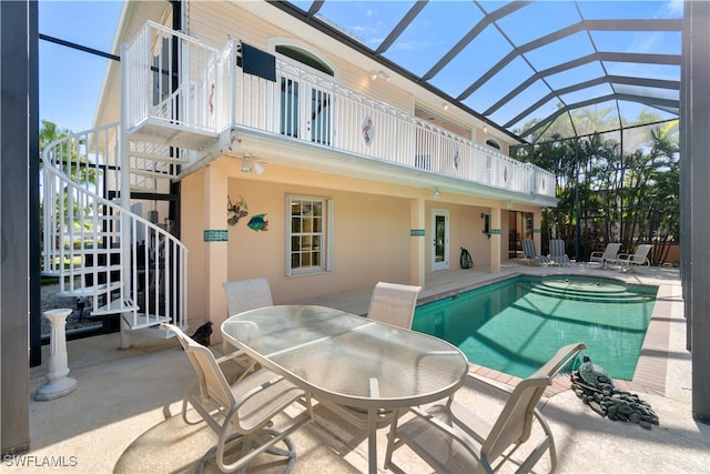 view of swimming pool with a lanai and a patio