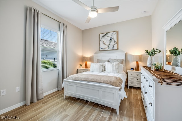 bedroom with ceiling fan and light hardwood / wood-style floors