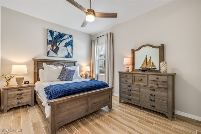 bedroom featuring light wood-type flooring and ceiling fan