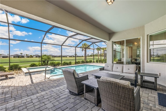 view of swimming pool with a hot tub, an outdoor hangout area, a patio area, and glass enclosure