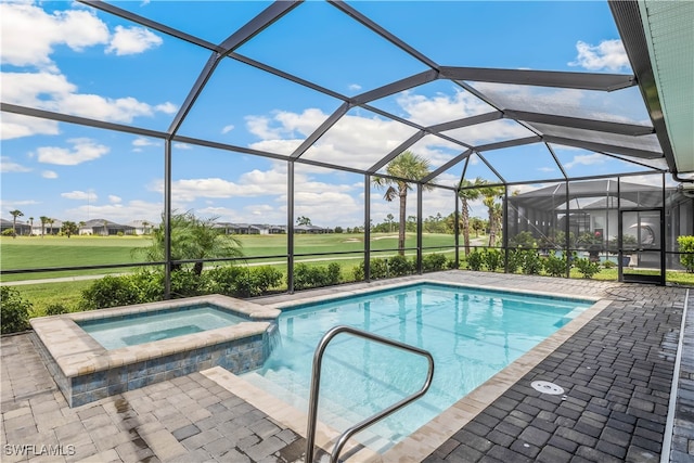 view of swimming pool featuring glass enclosure, an in ground hot tub, and a patio area