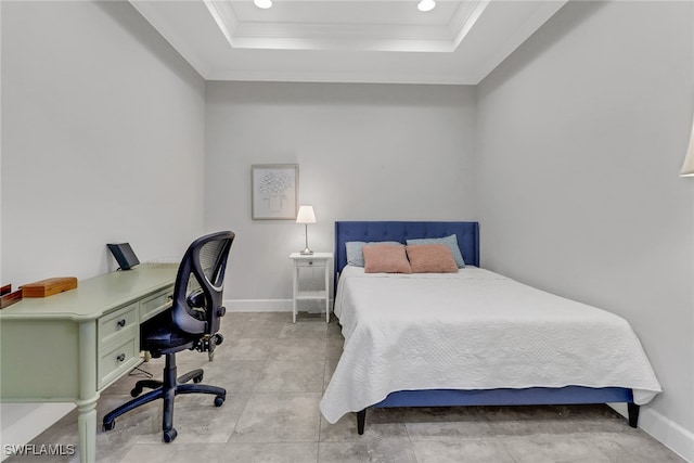 bedroom with a tray ceiling and ornamental molding