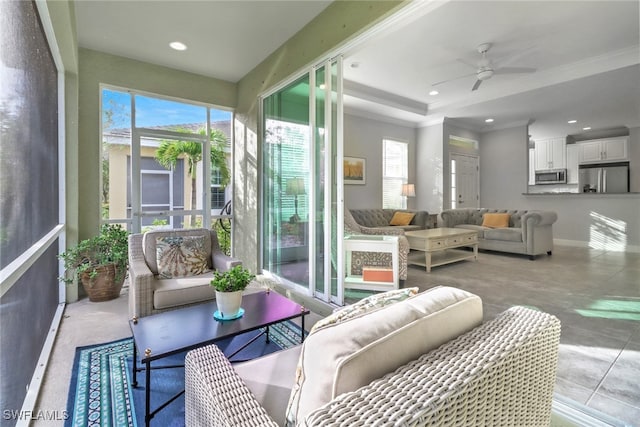 sunroom / solarium with ceiling fan