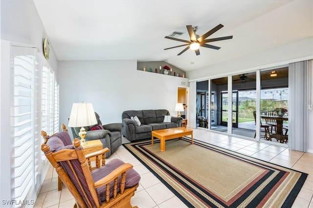 living room with ceiling fan, light tile patterned floors, and lofted ceiling