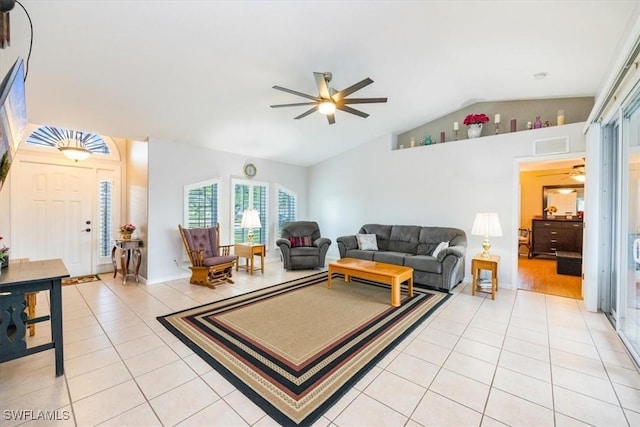 living room with light tile patterned flooring, vaulted ceiling, and ceiling fan