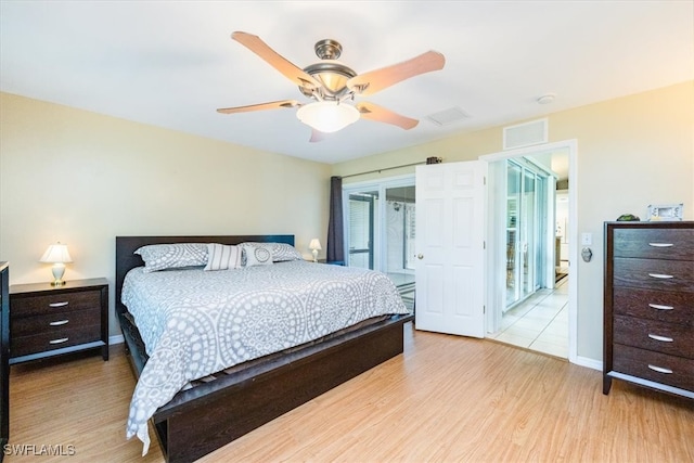 bedroom with access to exterior, light hardwood / wood-style floors, and ceiling fan