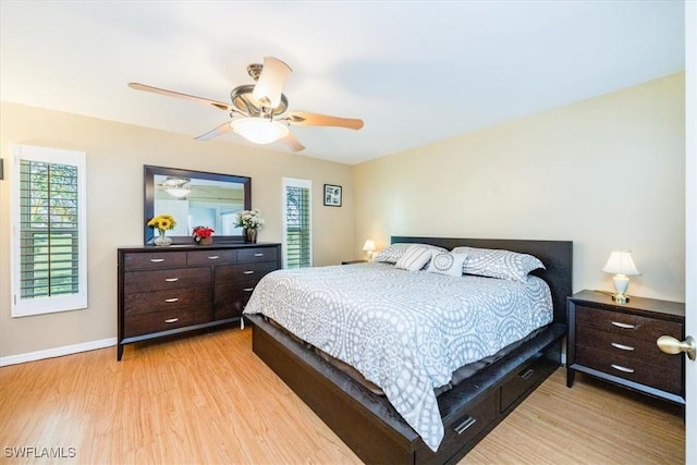 bedroom featuring light hardwood / wood-style floors and ceiling fan