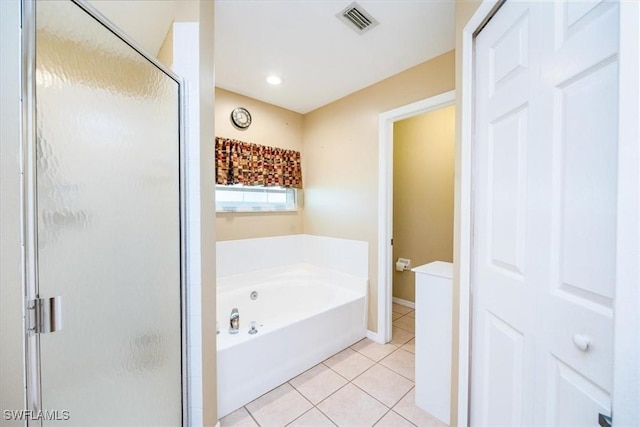 bathroom with tile patterned flooring and independent shower and bath