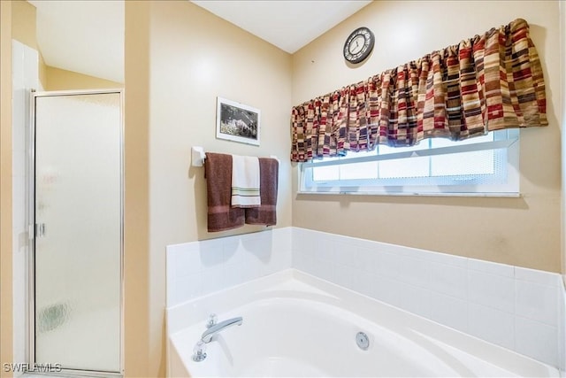 bathroom with separate shower and tub