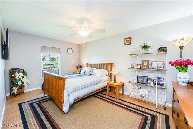 bedroom featuring light wood-type flooring and ceiling fan