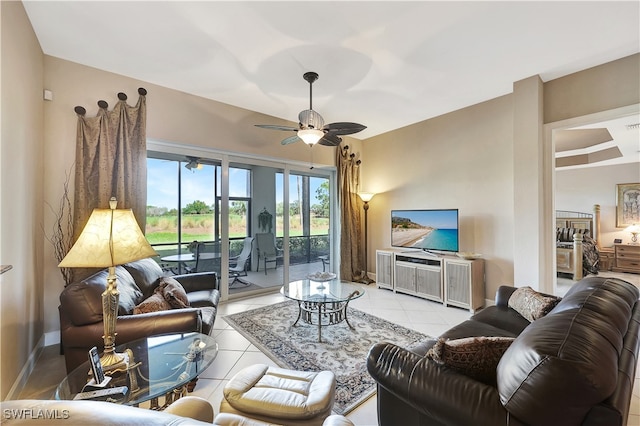 living room featuring ceiling fan and light tile patterned floors