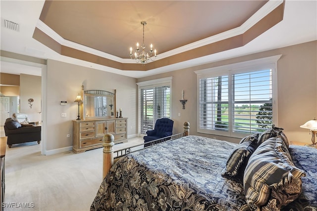 bedroom featuring a tray ceiling, carpet, a notable chandelier, and ornamental molding