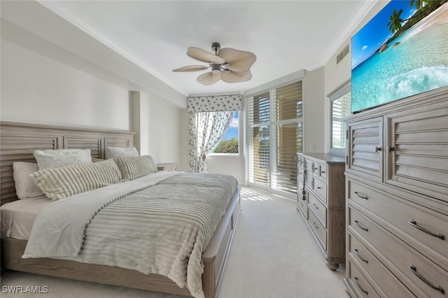 carpeted bedroom featuring ceiling fan, ornamental molding, and access to outside