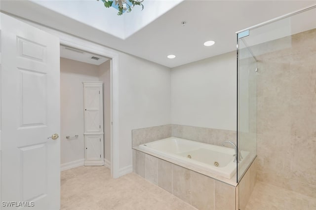 bathroom featuring tile patterned floors and independent shower and bath