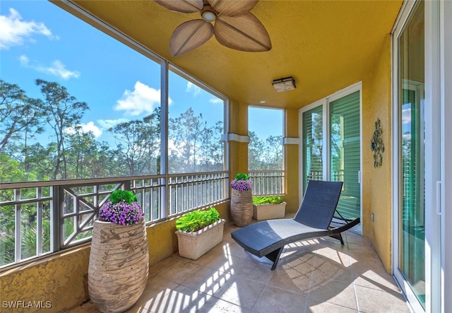 sunroom with ceiling fan and a healthy amount of sunlight