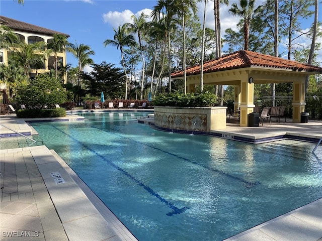 view of swimming pool with a gazebo and a patio area