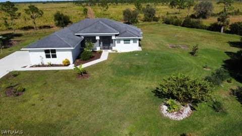 birds eye view of property with a rural view