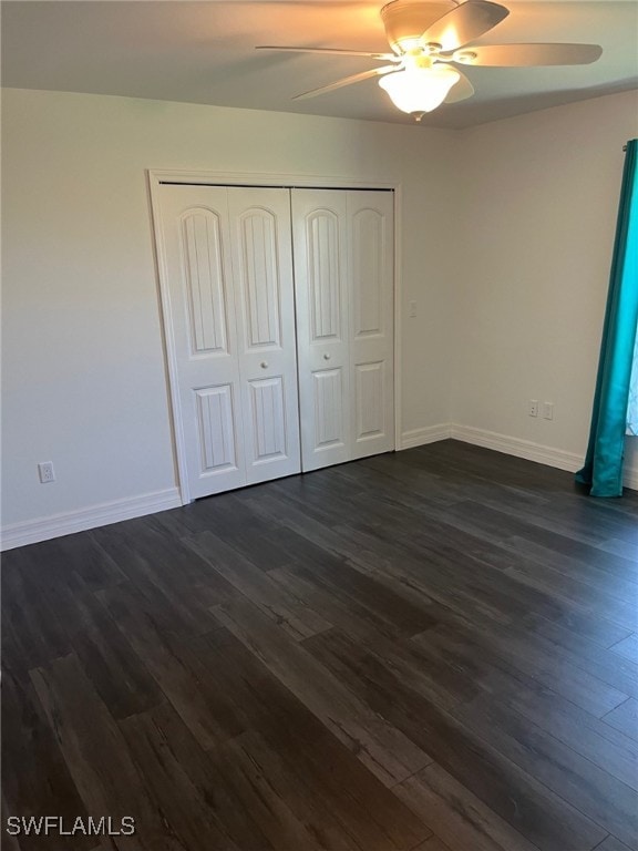 unfurnished bedroom with a closet, ceiling fan, and dark hardwood / wood-style floors